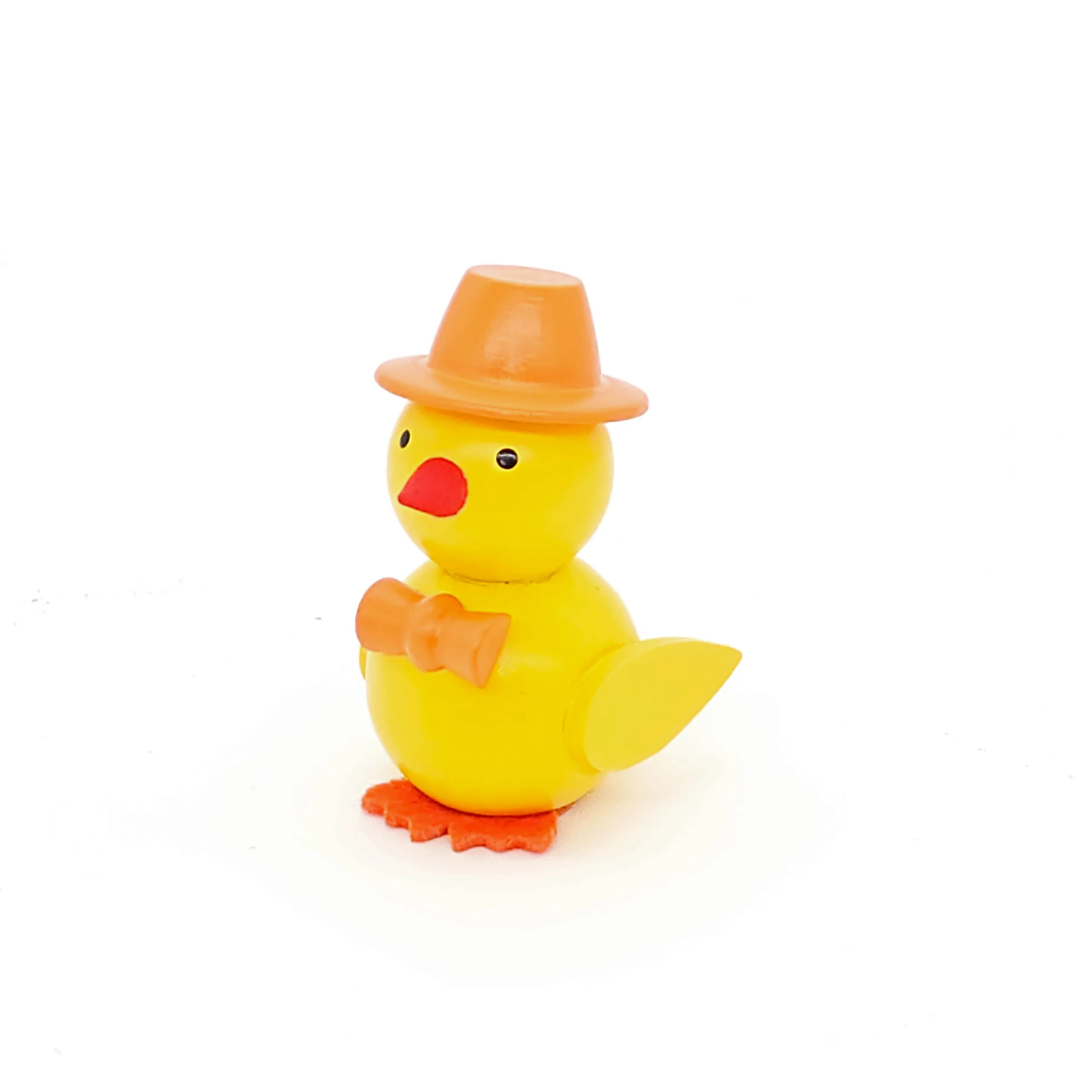 kleine gelbe Küken aus Holz mit orangem Hut und Schleife
